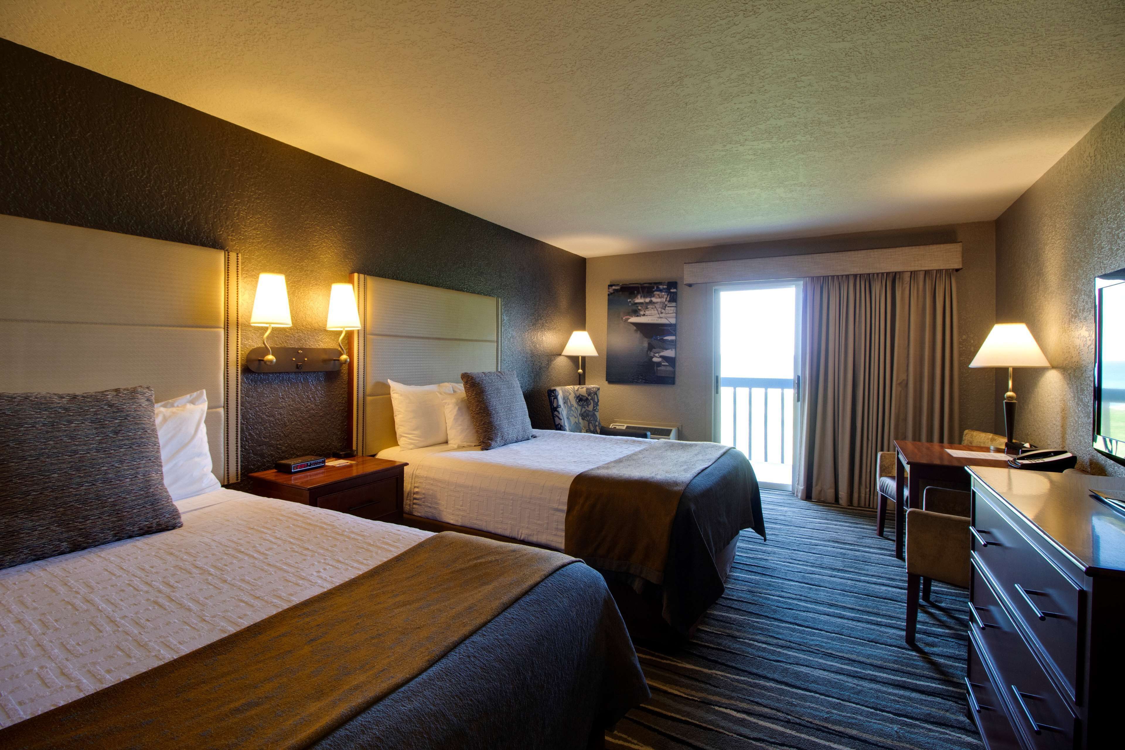 standard room, 2 double beds, refrigerator, lake view | in-room safe, desk, iron/ironing board, free cots/infant beds