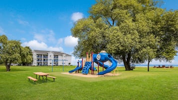 Enjoy a peaceful retreat in our park with a playground featuring a slide and climbing structures.