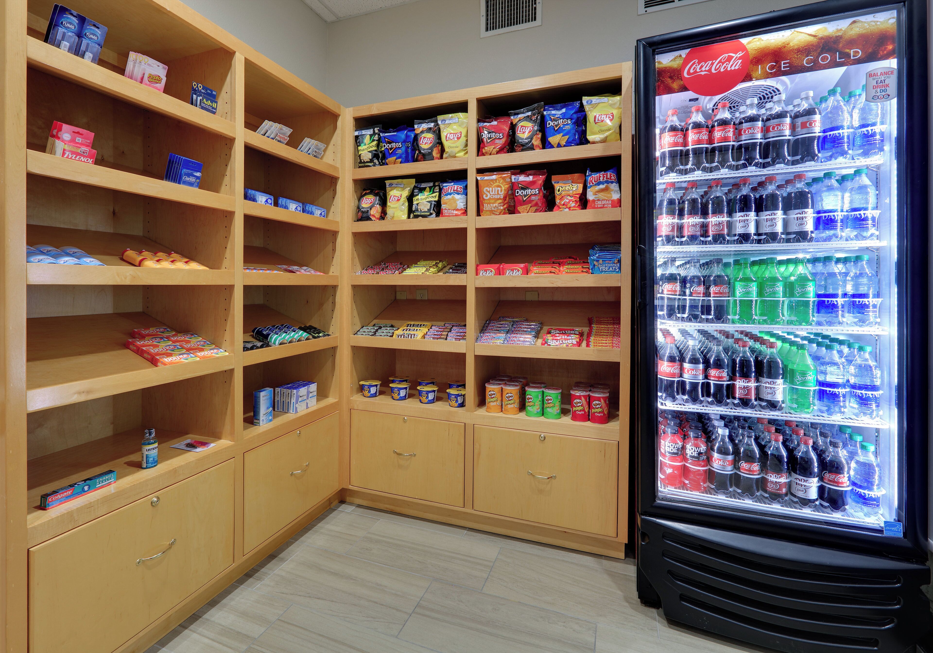 A snack and drink vending machine with a variety of snacks and beverages.