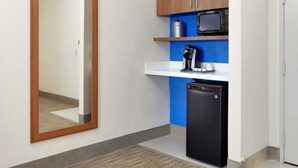 A compact kitchenette with a microwave, coffee maker, and refrigerator. - Holiday Inn Express & Suites Austin Round Rock by IHG (Round Rock)