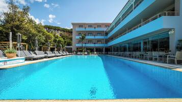 Seasonal outdoor pool, open 8:00 AM to 6:30 PM, pool umbrellas