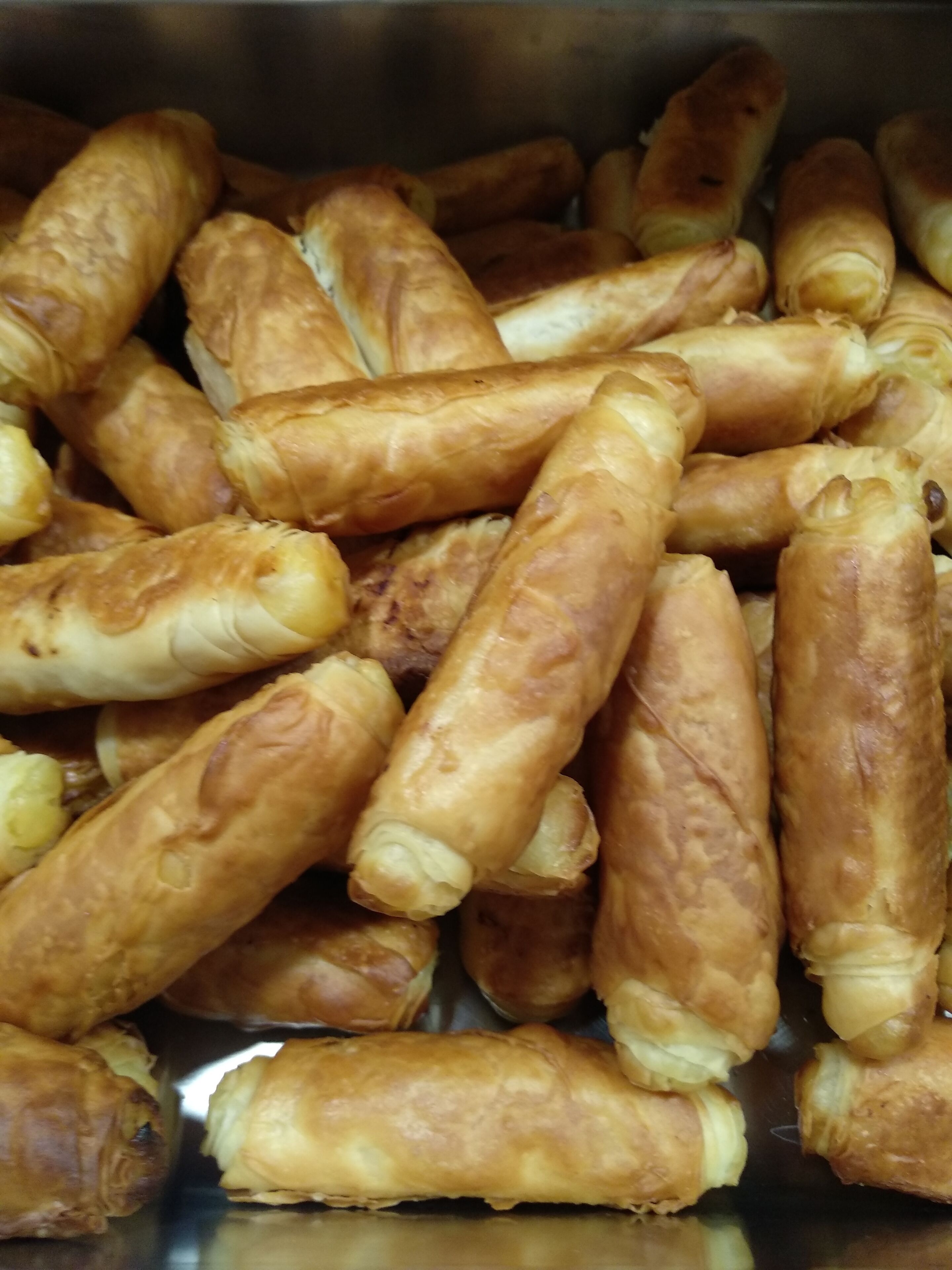 A container filled with golden-brown pastries.