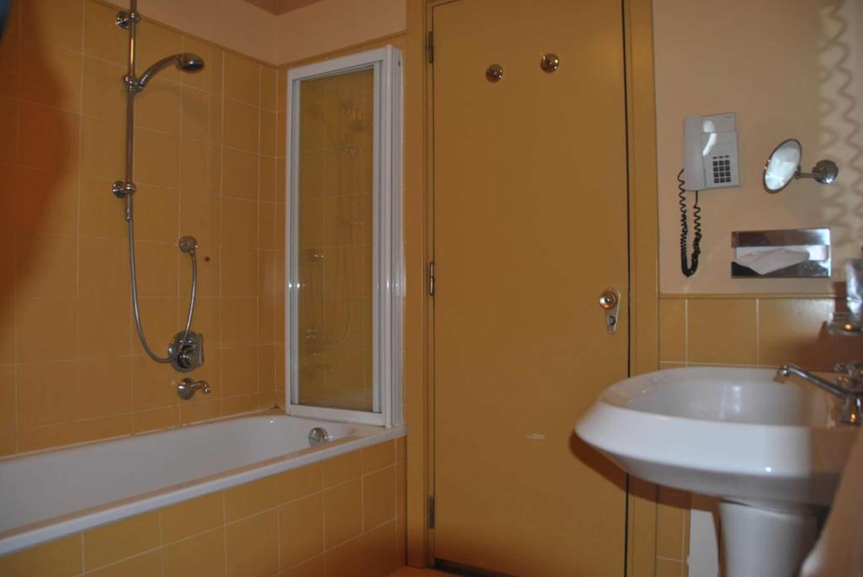 superior double room | bathroom | eco-friendly toiletries, hair dryer, bidet, towels