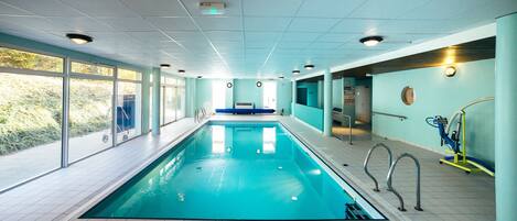 Indoor pool, open 9:00 AM to 8:00 PM, pool loungers