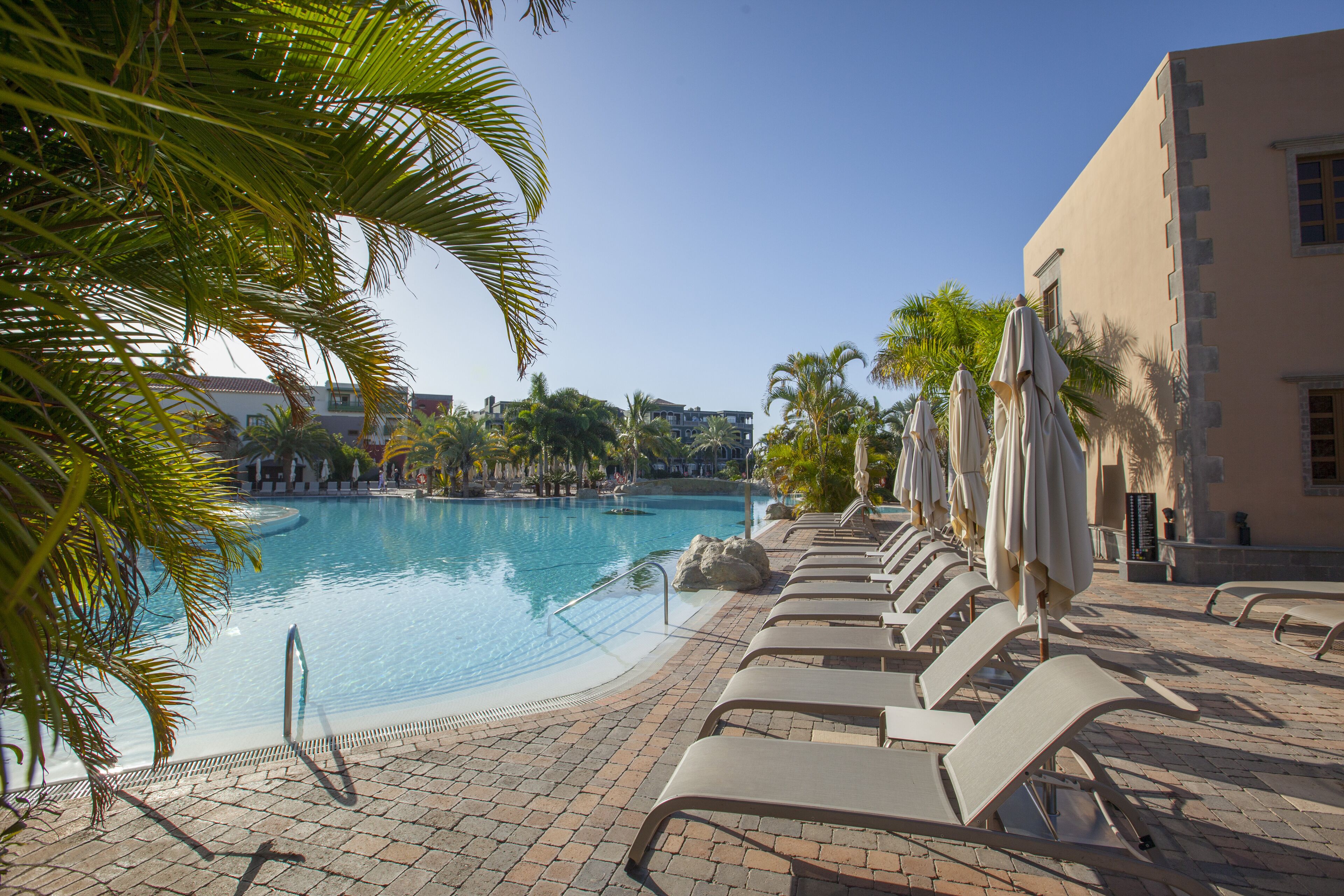 6 outdoor pools, pool umbrellas, pool loungers