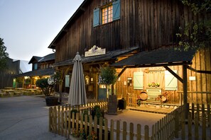 A rustic wooden building with a sign reading "TRADING POST".