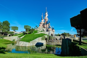 A castle-like structure with a moat and pathways.