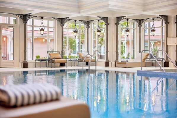 Indoor pool, open 7:00 AM to 10:00 PM, pool loungers, lifeguards on site