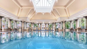 A large indoor swimming pool with a high ceiling and large windows. - Disneyland® Hotel (Chessy)