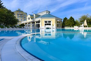 Indoor pool, outdoor pool, open 7 AM to 10 PM, pool loungers