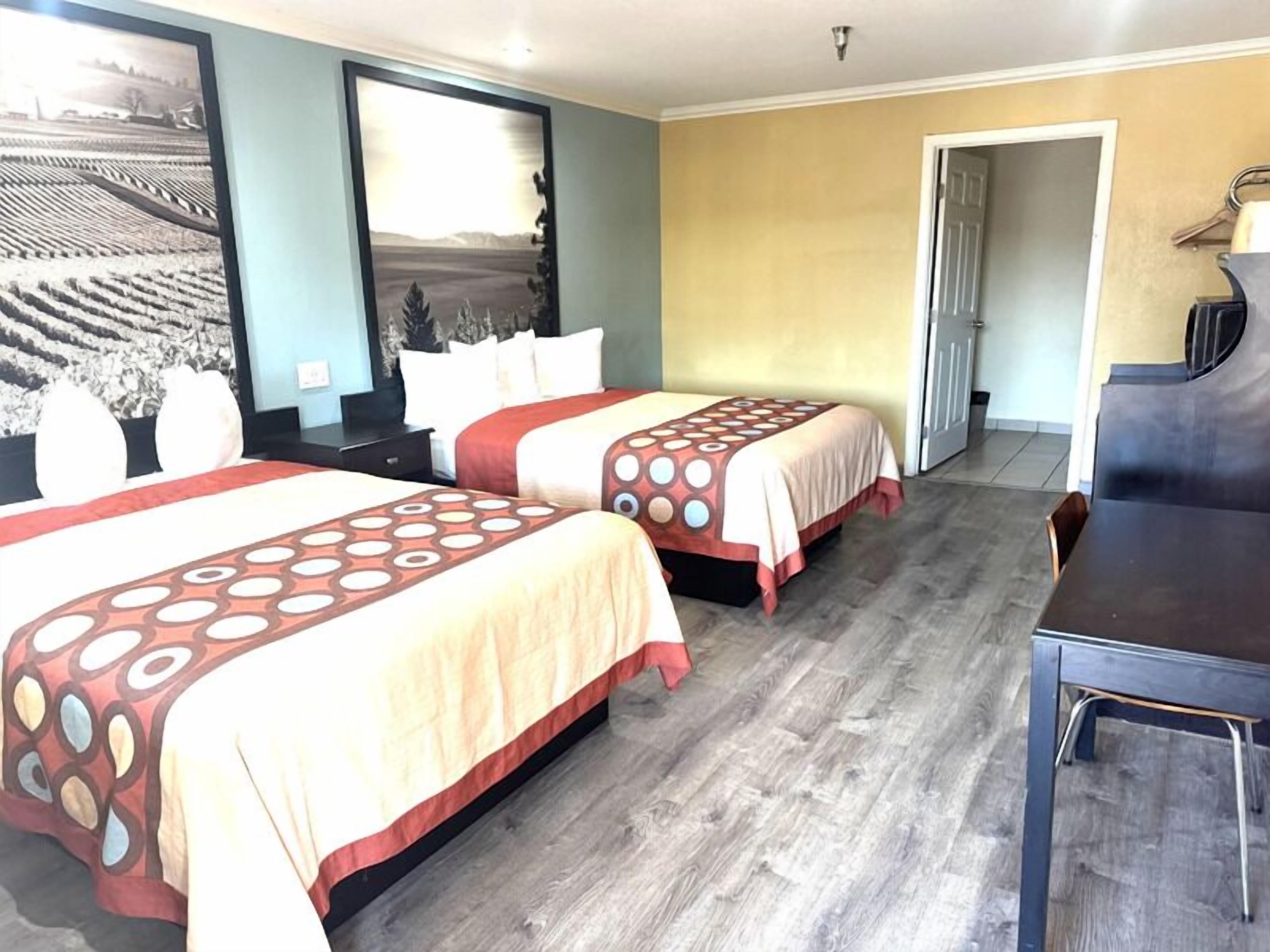 Deluxe room with two queen beds | Premium bedding, down comforters, desk, blackout drapes