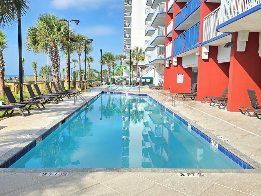 2 indoor pools, 2 outdoor pools, open 9:00 AM to 11 PM, pool umbrellas