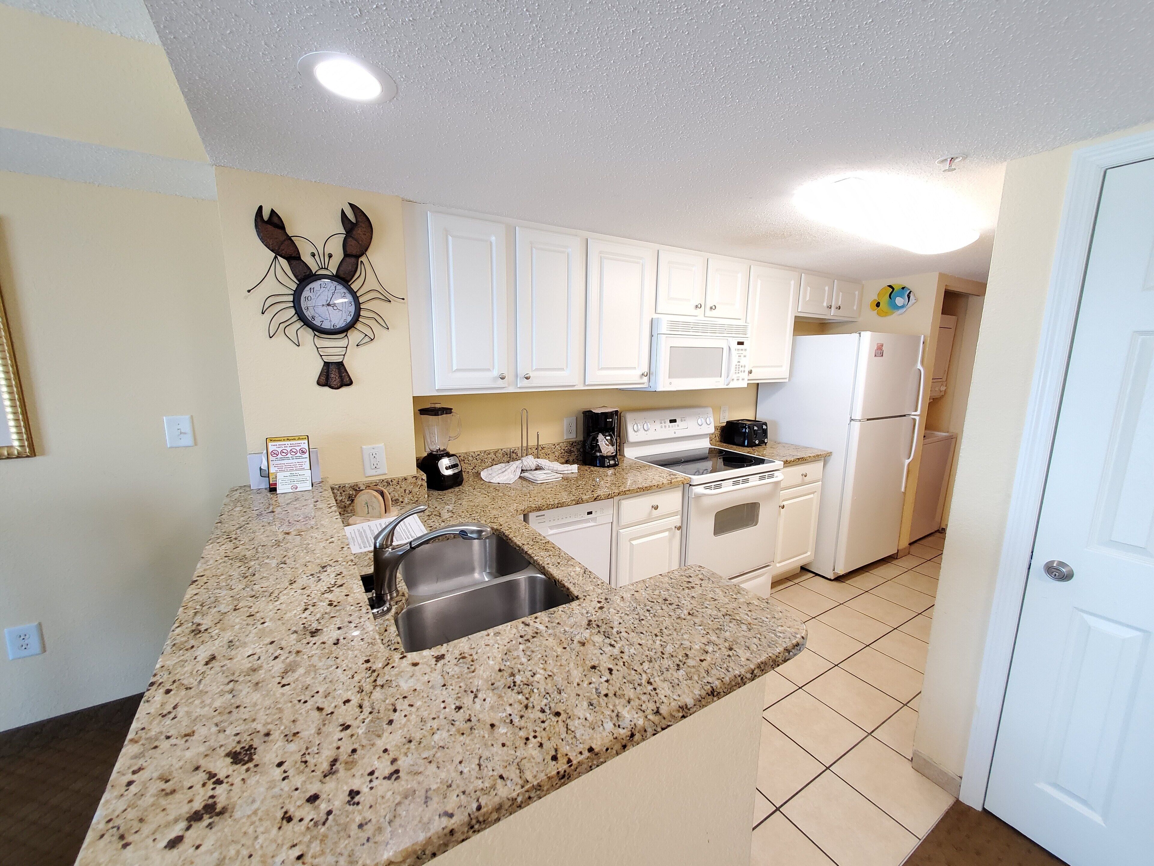 classic condo, 1 bedroom, king bed, kitchen, oceanfront (plus murphy bed) | private kitchen | coffee/tea maker, freezer