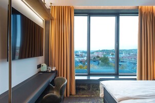 Desk, laptop workspace, blackout drapes, iron/ironing board