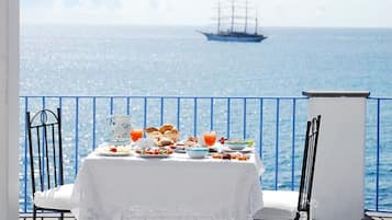 Enjoy a serene meal for two with a scenic view of the water.