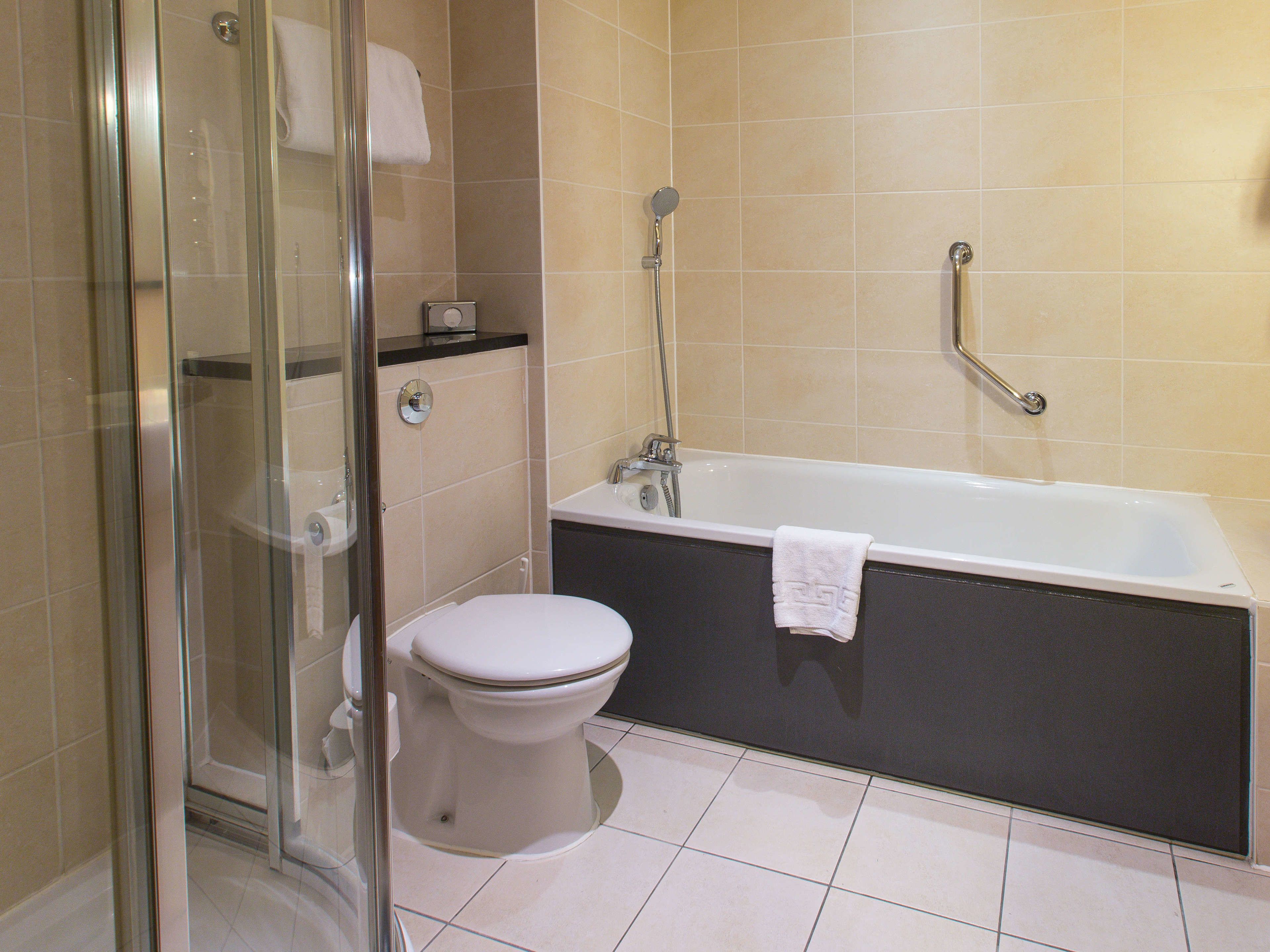 separate bathtub and shower, free toiletries, hair dryer, towels