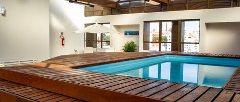 Indoor pool, open 9:00 AM to 10:00 PM, pool loungers