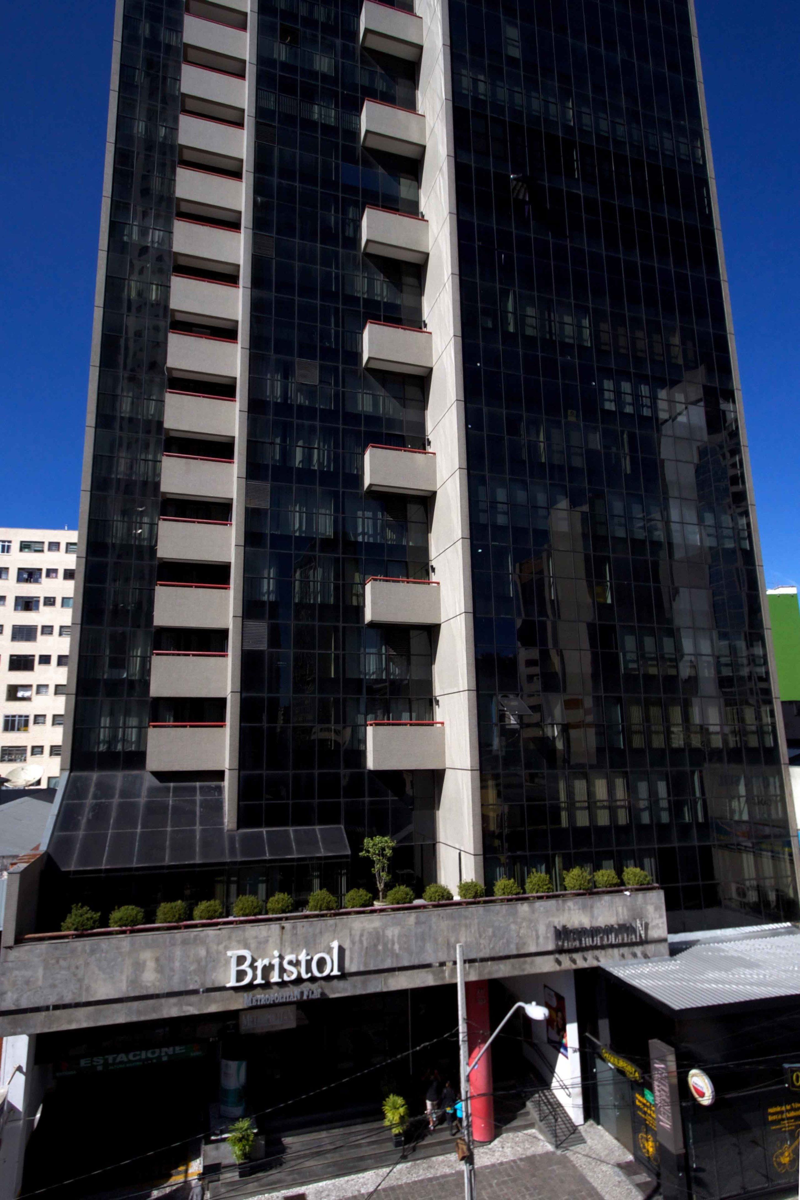 A tall, modern building with the name "Bristol" on the ground floor.