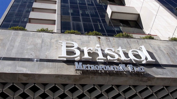 A tall building with a sign reading "Bristol Metropolitan Police."