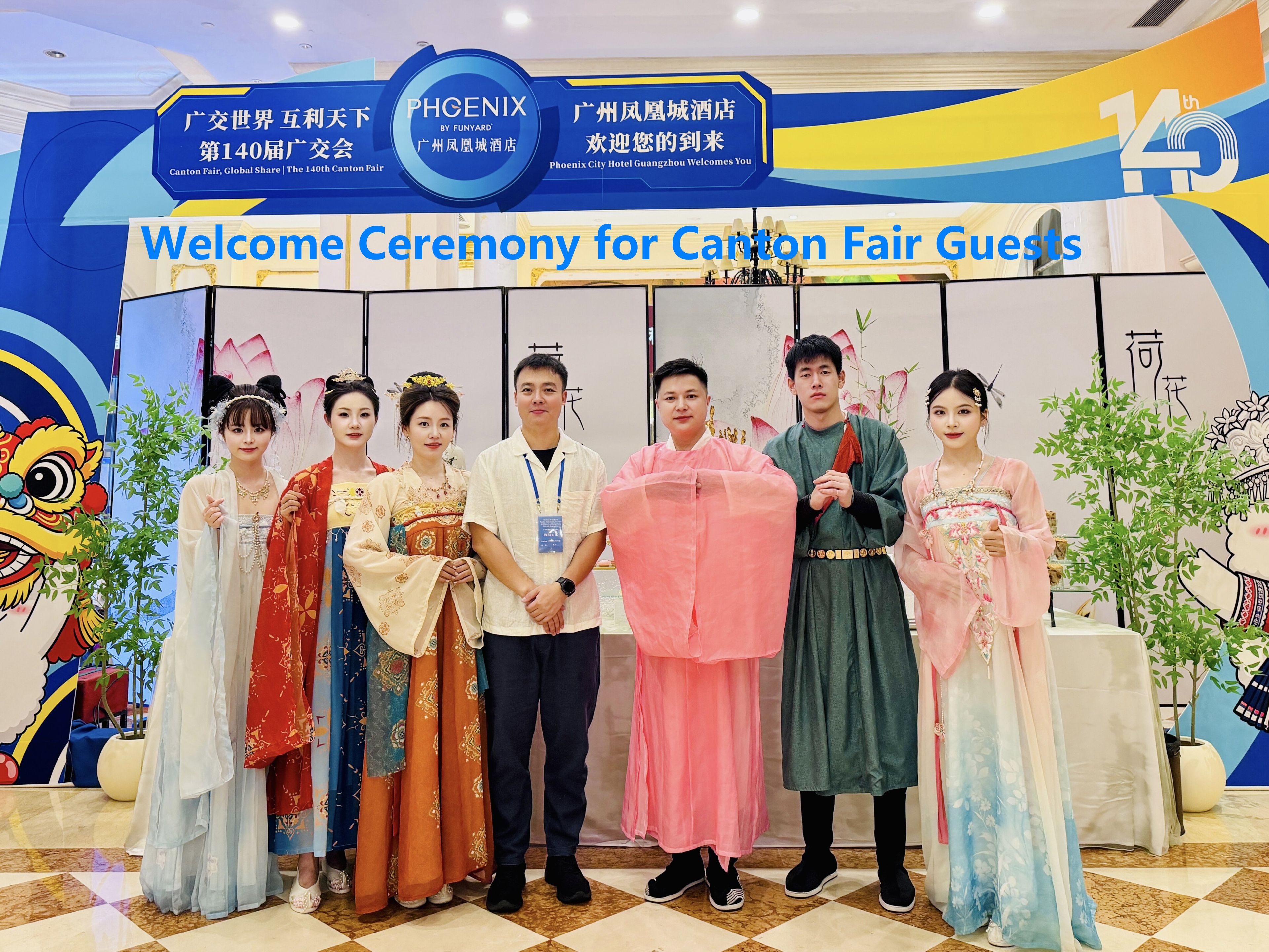 A group of people in traditional attire at a hotel event.