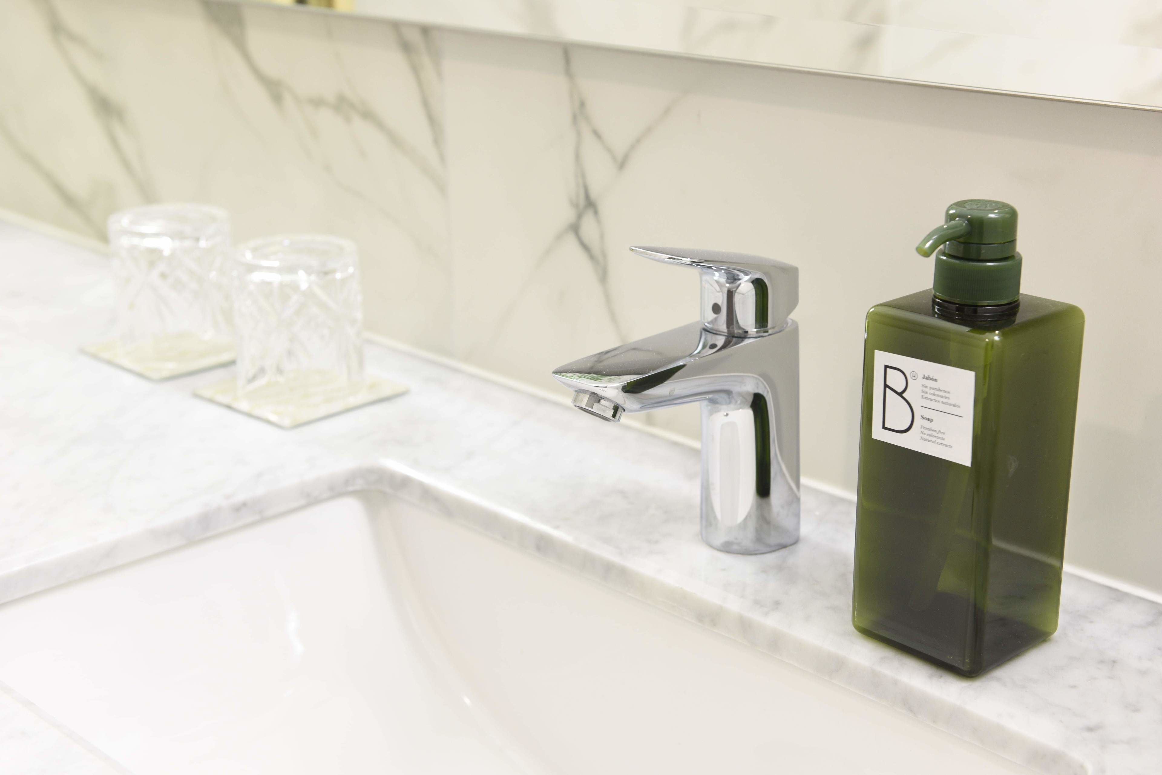 standard double room, 2 queen beds | bathroom | shower, eco-friendly toiletries, hair dryer, towels