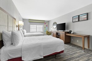 A hotel room with two beds, a desk, a TV, and a window. - Hampton Inn Salem, VA (Salem)