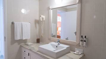 Eco-friendly toiletries, hair dryer, towels