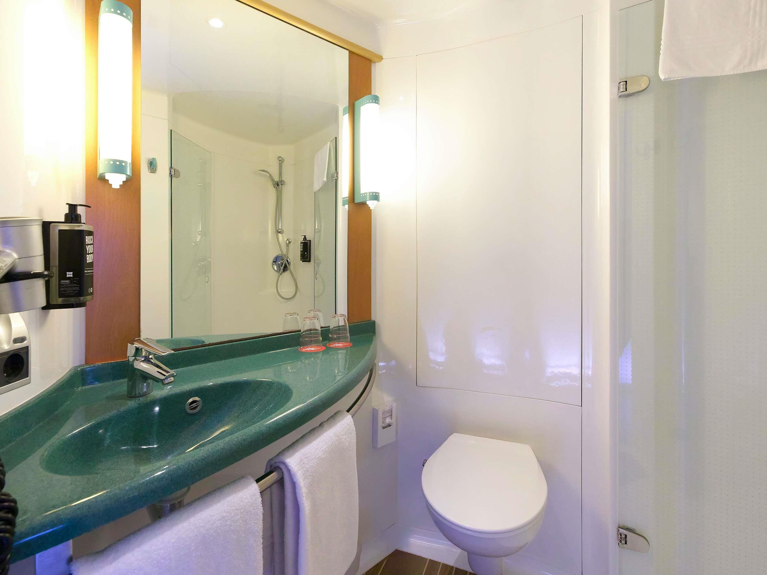 hypo-allergenic bedding, desk, laptop workspace, blackout curtains