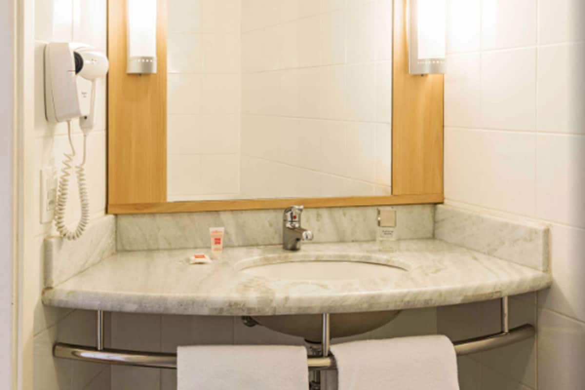 shower, eco-friendly toiletries, hair dryer, towels