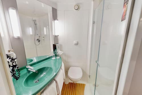 Shower, eco-friendly toiletries, hair dryer, towels