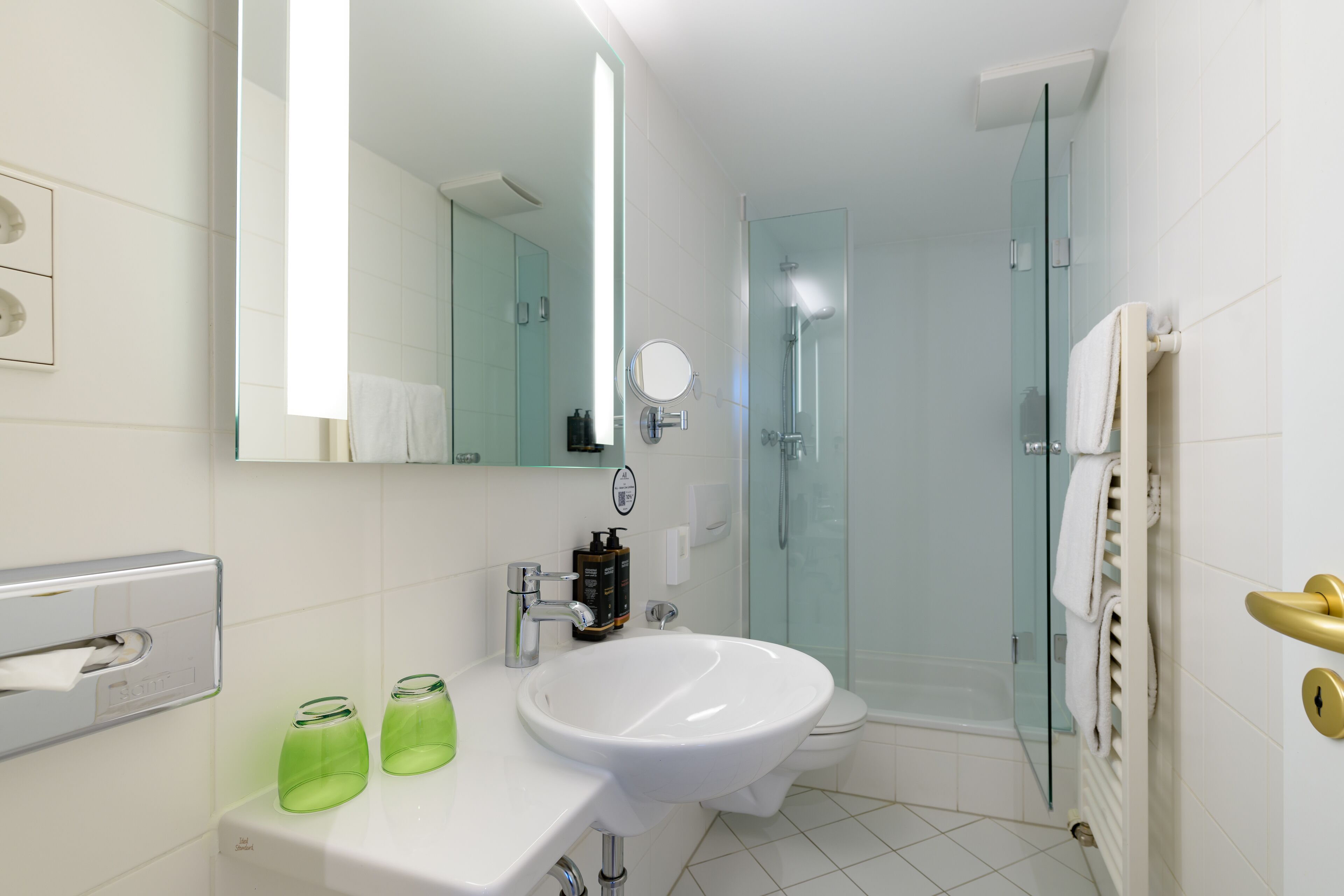 eco-friendly toiletries, hair dryer, slippers, towels