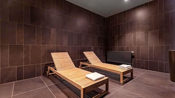 Indoor pool, open 7:00 AM to 10:00 PM, pool loungers, lifeguards on site