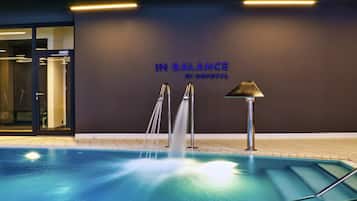 Indoor pool, open 7:00 AM to 10:00 PM, pool loungers, lifeguards on site