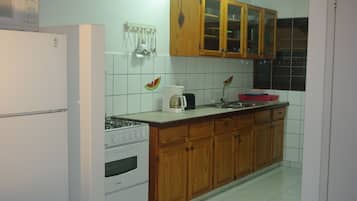 Standard Apartment, 2 Bedrooms | Private kitchen | Full-size fridge, microwave, stovetop, coffee/tea maker