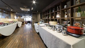A buffet setup with various food containers and a red pot on a counter. - APA Hotel TKP Sapporo Ekimae (Sapporo)