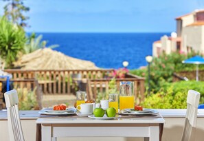 A table set for breakfast with a view of the ocean. - Vasia Resort and SPA, Sissi, Crete (Agios Nikolaos)