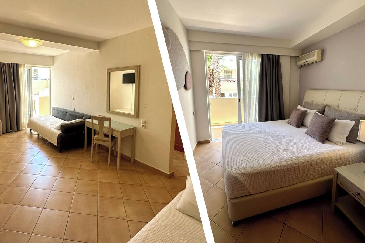 Una habitación de hotel con cama, escritorio, silla, espejo y ventana con cortinas.