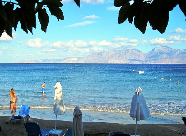 On the beach, beach shuttle, sun-loungers, beach umbrellas