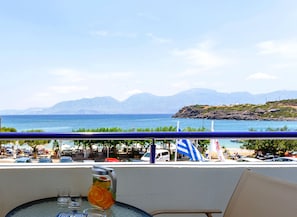 Enjoy a meal or relax on this seaside terrace with a view of the distant mountains.