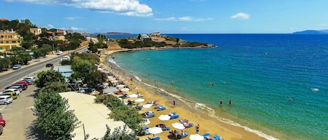 On the beach, beach shuttle, sun loungers, beach umbrellas