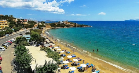 On the beach, beach shuttle, sun loungers, beach umbrellas