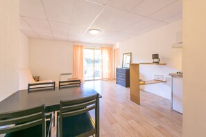 Apartment, 1 Bedroom | Living area | Flat-screen TV