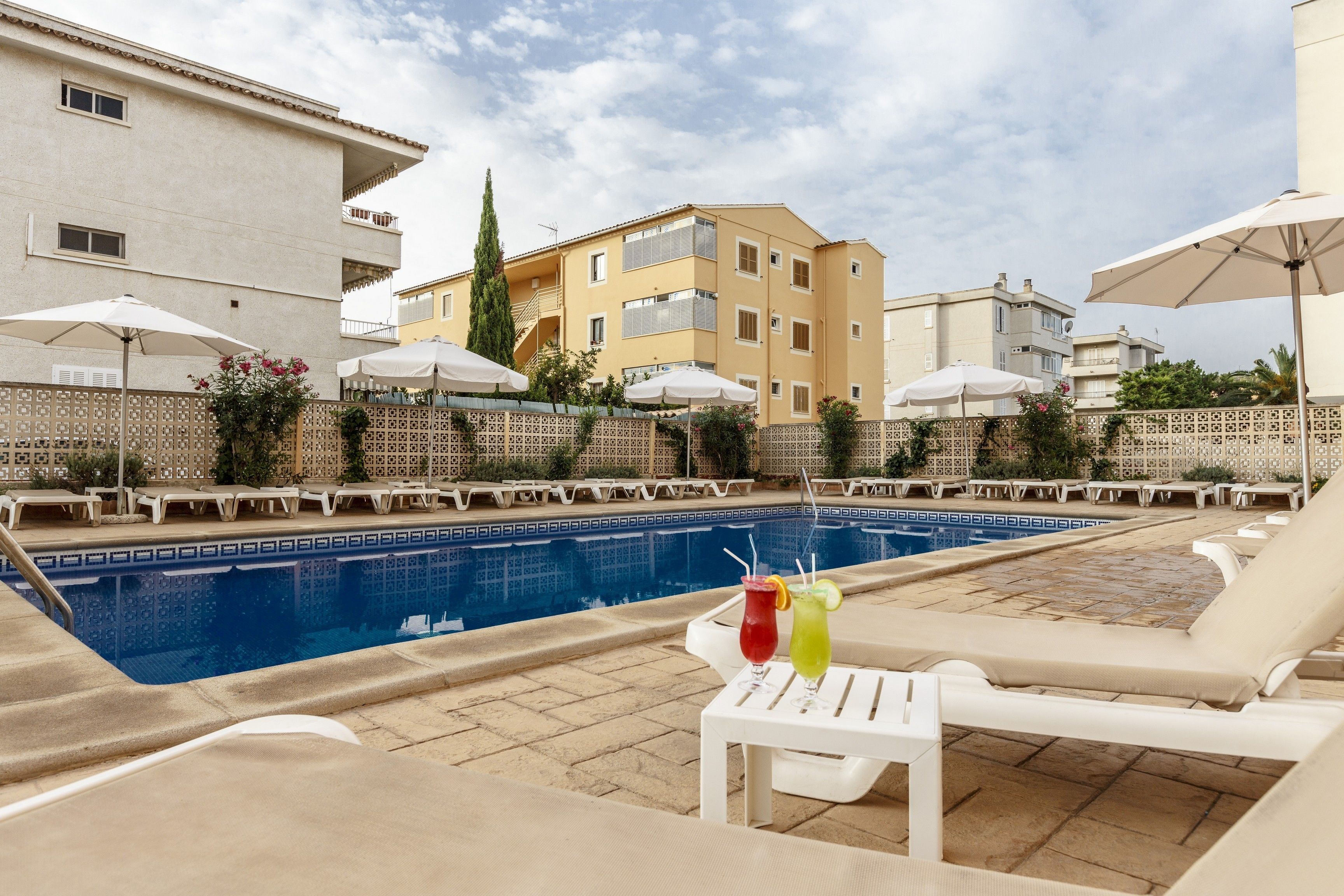 outdoor pool, pool umbrellas, pool loungers