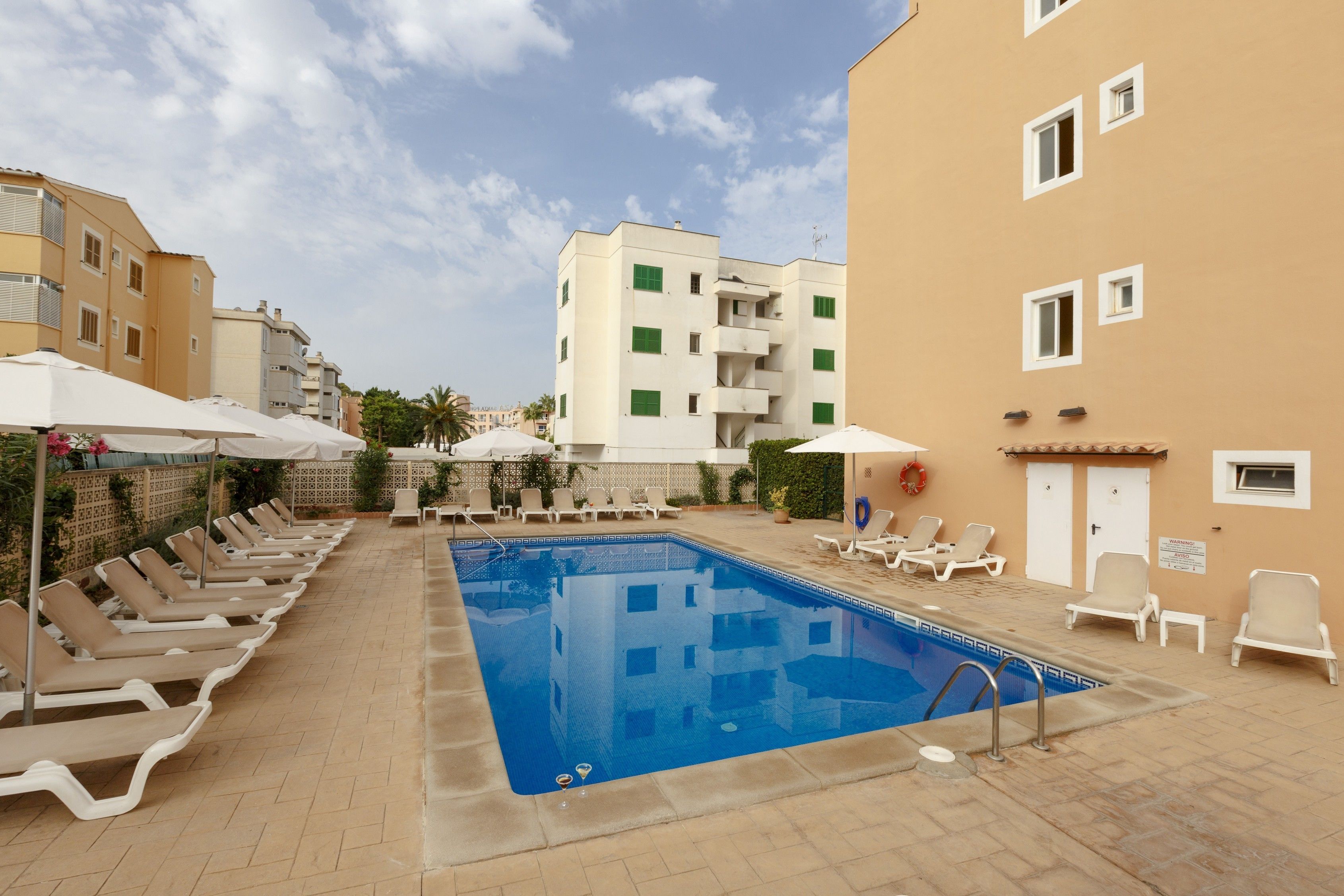 outdoor pool, pool umbrellas, pool loungers