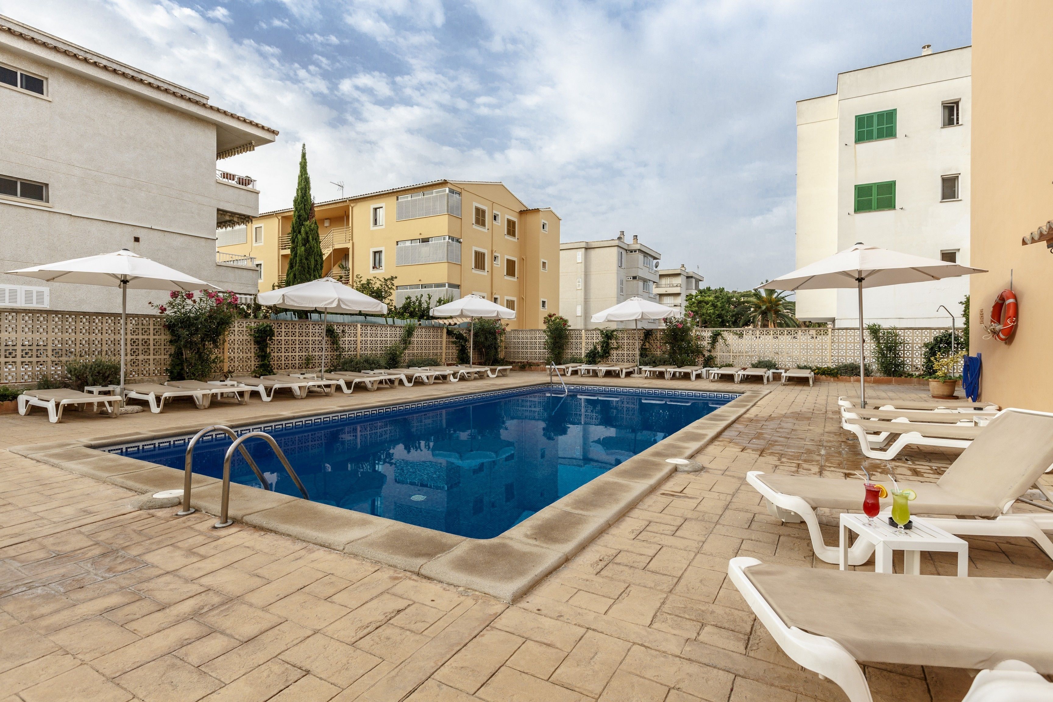 outdoor pool, pool umbrellas, pool loungers