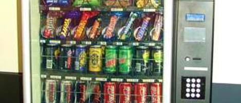 A vending machine stocked with various snacks and drinks.