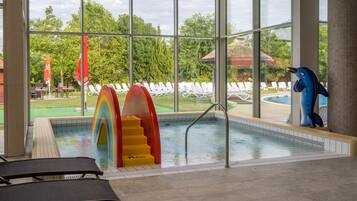 Relax by the pool with clear views of the surrounding landscape, featuring a ladder and colorful steps.