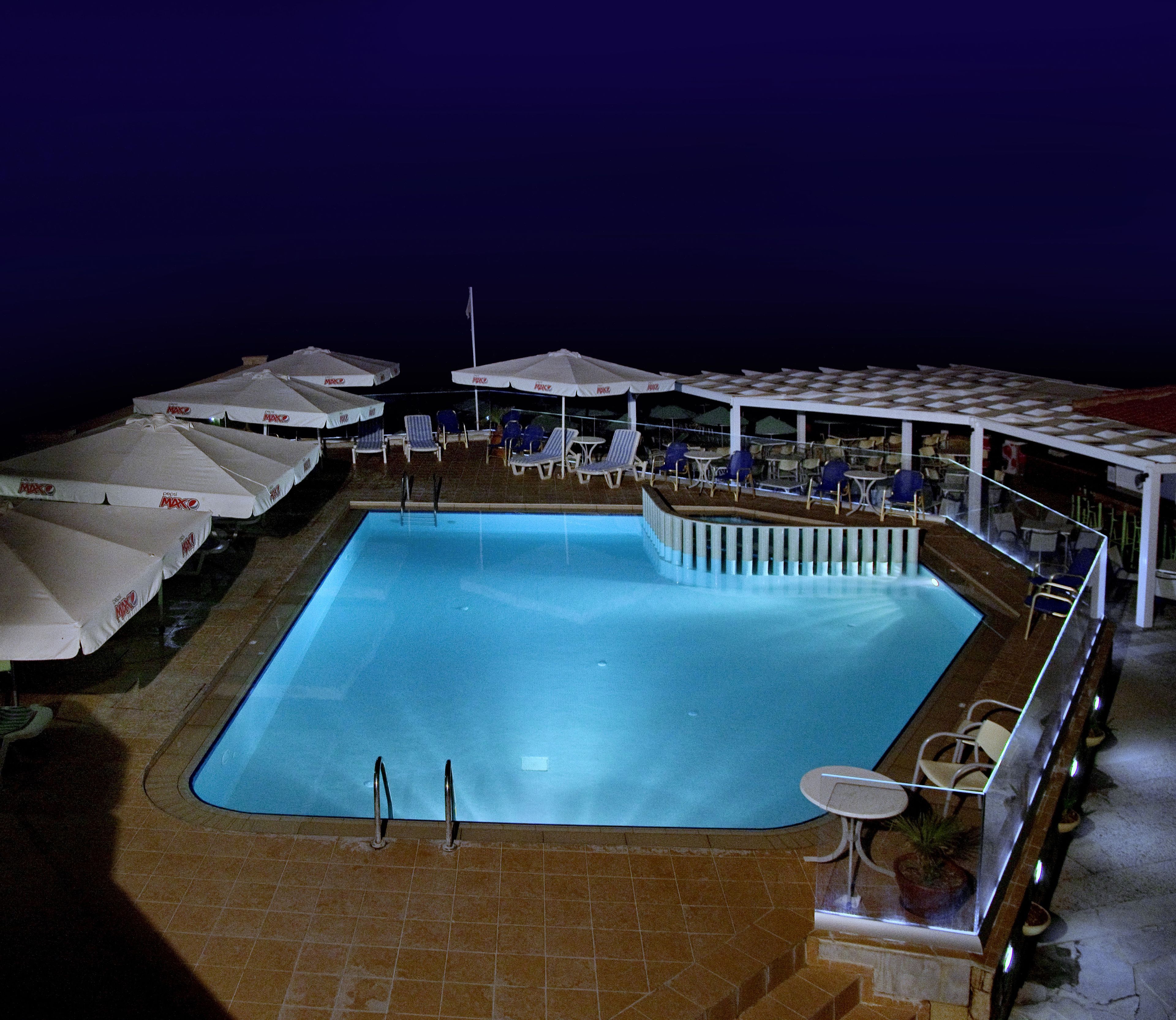 Seasonal outdoor pool, open 9:00 AM to 5:00 PM, pool umbrellas
