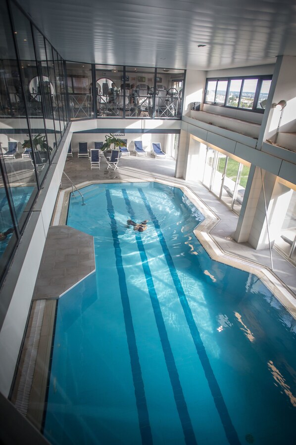 Indoor pool, open 9:00 AM to 9:00 PM, pool loungers