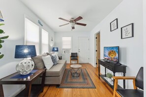 Cottage Apartment, 2 Bedrooms (Check-In Age 25) | Living area | 32-inch TV with cable channels - Daytona Inn And Suites (Wildwood)